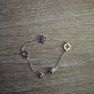 Delicate Gold Charm Bracelet with Star and Flower
